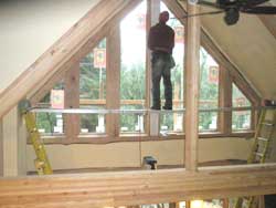 Scott Smith doing interior trim on the tall windows